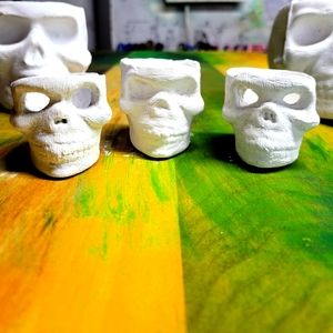 Skull cups, shot glasses, and candle holders